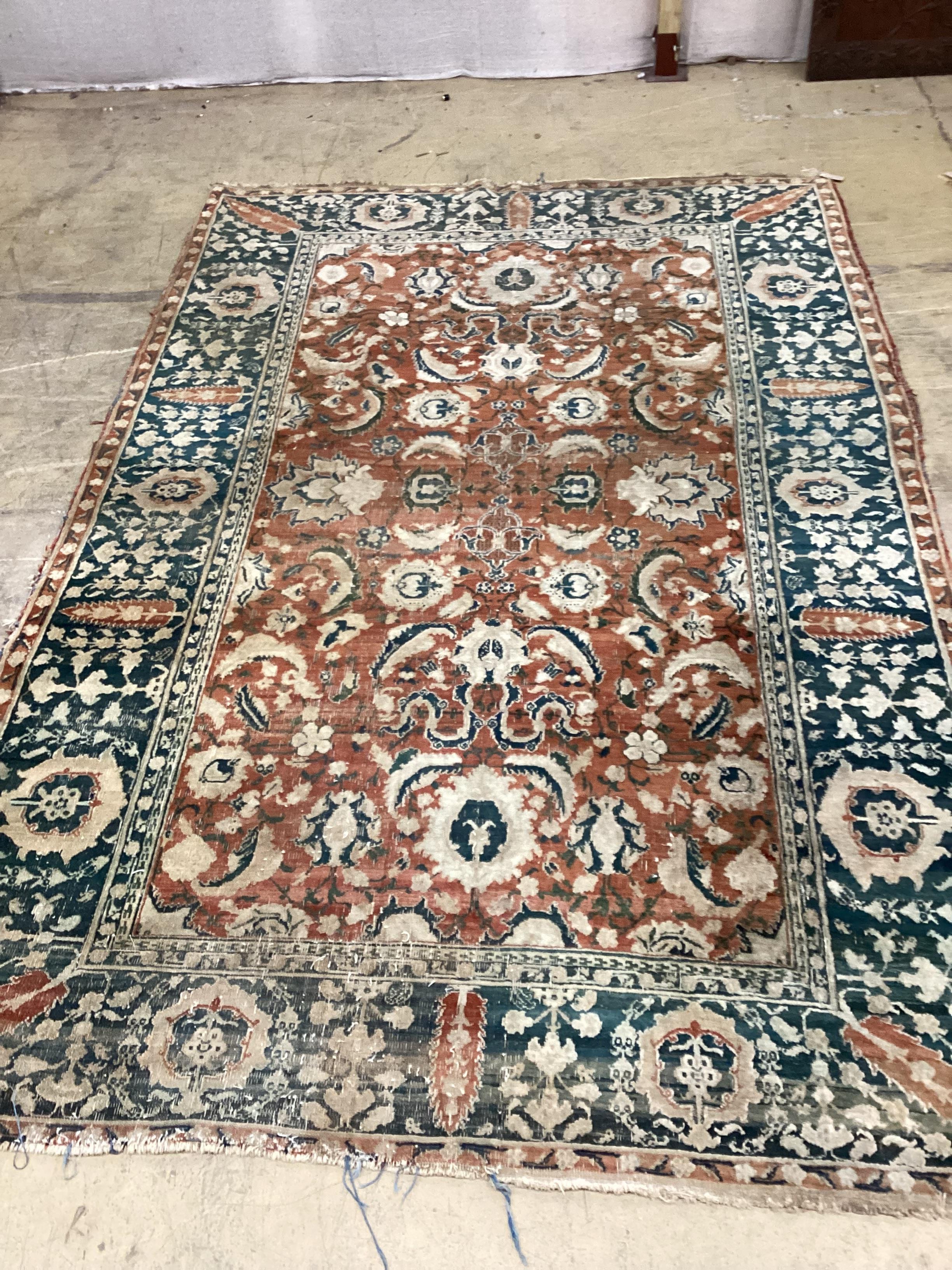 A Heriz red ground carpet, 300 x 203cm